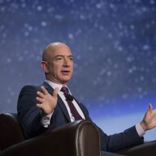 Image: Jeff Bezos speaks during the 32nd Space Symposium